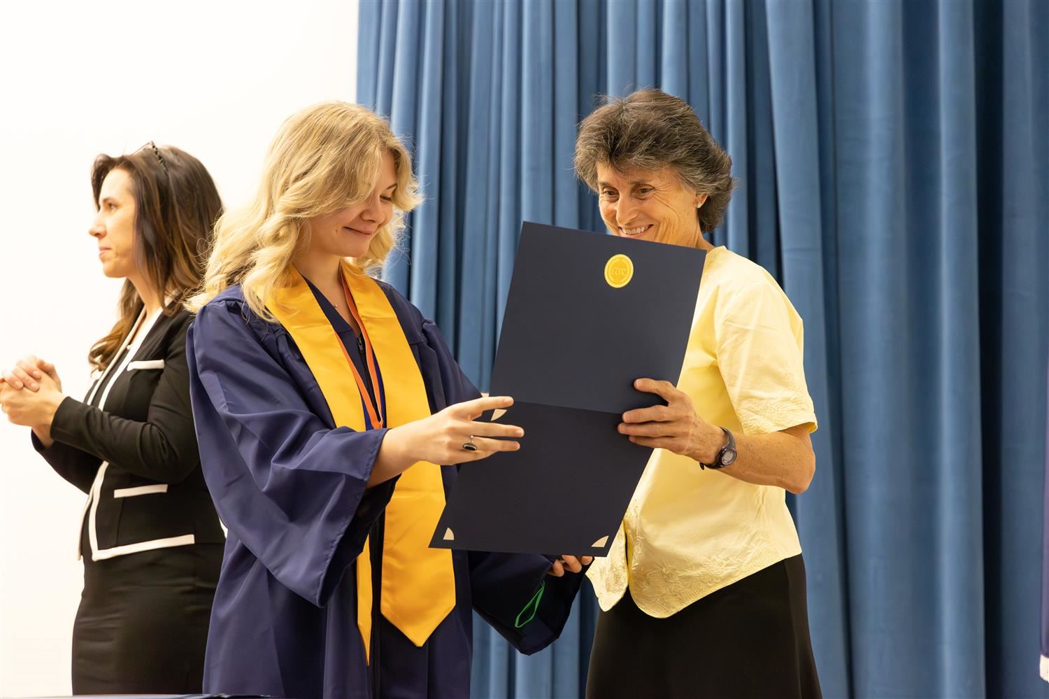  Maury HS student receiving diploma